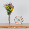 Spring Mockup With Hexagonal Frame And Vase Of Flowers Over Table Psd