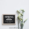 Spring Mockup With Slate Next To White Flowers Psd