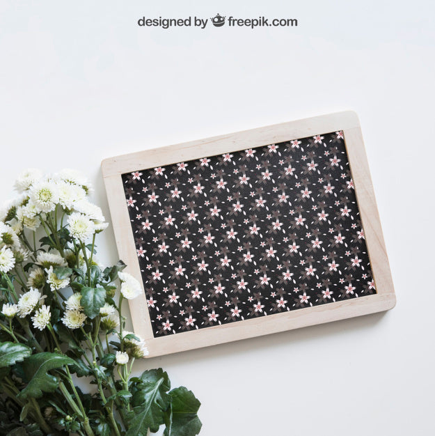 Spring Mockup With Slate Next To Wildflowers Psd