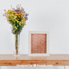Spring Mockup With Vertical Frame And Vase Of Flowers Over Table Psd