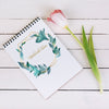 Spring Notebook Mockup With Decorative Plant In Top View Psd