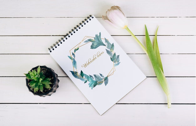 Spring Notebook Mockup With Decorative Plant In Top View Psd