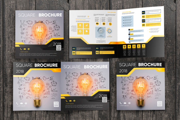Square Brochure Mockup On Wooden Surface Psd