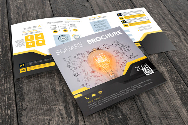 Square Brochure Mockup On Wooden Surface Psd