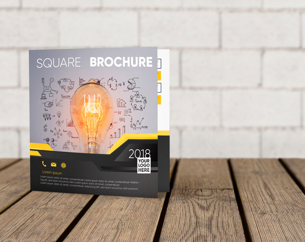Square Brochure Mockup On Wooden Surface Psd