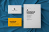 Stationary With Big Card And Two Bussiness Cards Over Fabric Background Mockup Psd