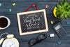 Stationery And Chalkboard In Workspace Psd