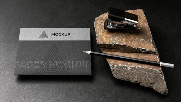 Stationery Mock-Up On Dark Concrete With Rugged Rock Psd