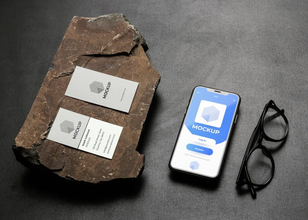 Stationery Mock-Up On Dark Concrete With Rugged Rock Psd