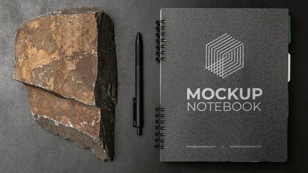 Stationery Mock-Up On Dark Concrete With Rugged Rock Psd