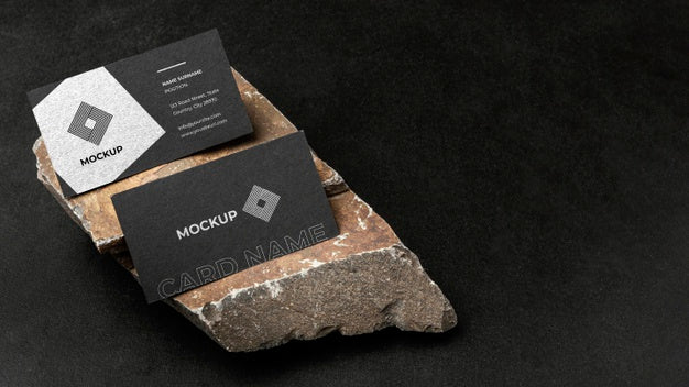 Stationery Mock-Up On Dark Concrete With Rugged Rock Psd