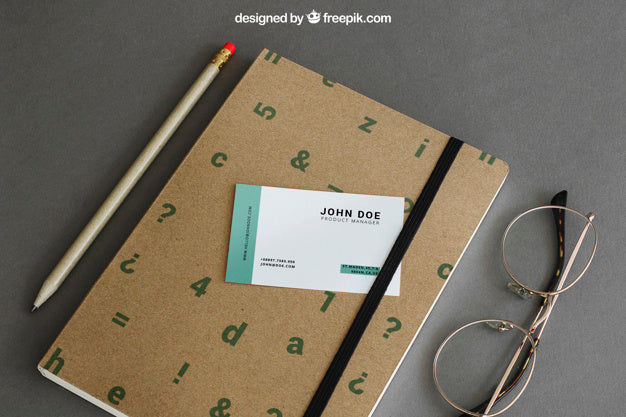 Stationery Mockup With Business Card On Book Psd