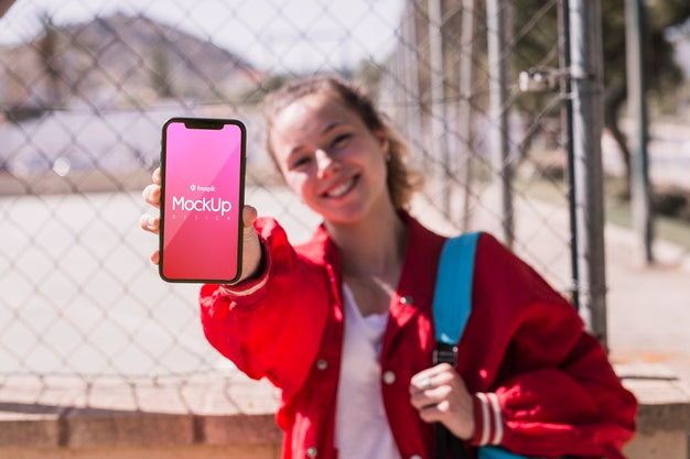 Student Girl Showing Her Phone Mock-Up Psd