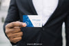 Stylish Businessman Holding Business Card Mockup Psd