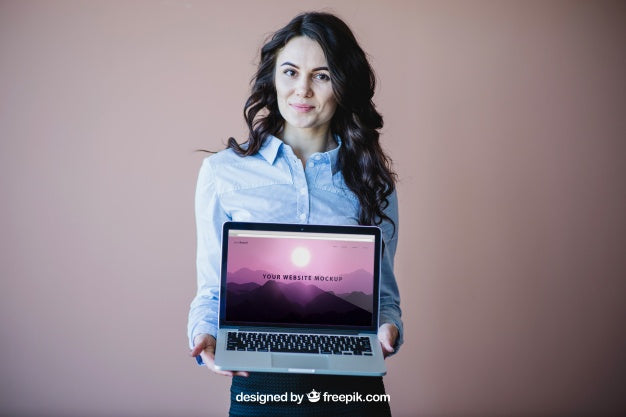Stylish Businesswoman Presenting Laptop Psd
