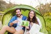 Summer Camp Mockup With Couple Pointing At Tablet Psd