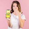 Surprised Young Woman Covering Her Mouth And Holding A Cellphone Mock-Up Psd
