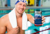 Swimmer In A Pool House Holding A Mock-Up Mobile Phone Psd