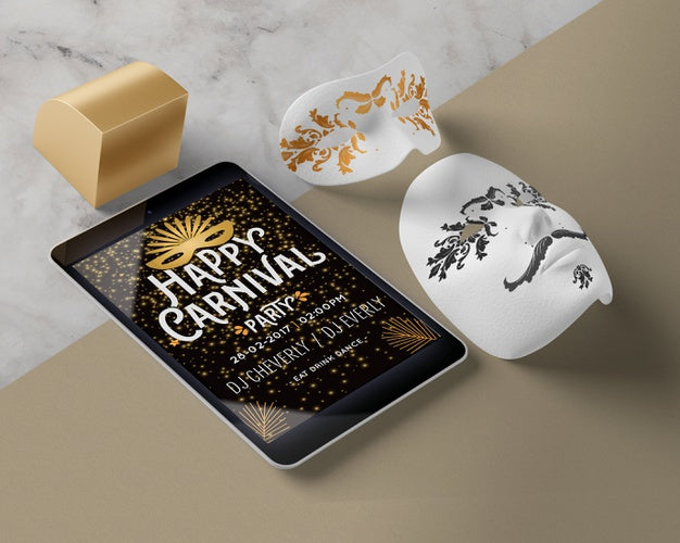 Tablet And Carnival Masks On Table Psd