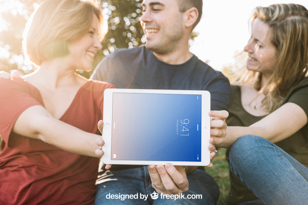 Tablet Mockup With Friends Outdoors Psd