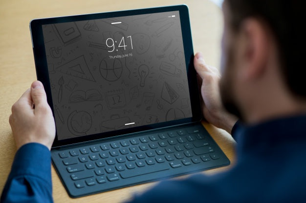 Tablet Mockup With Keyboard And Man Psd