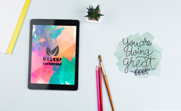 Tablet On Desk With Tools Psd