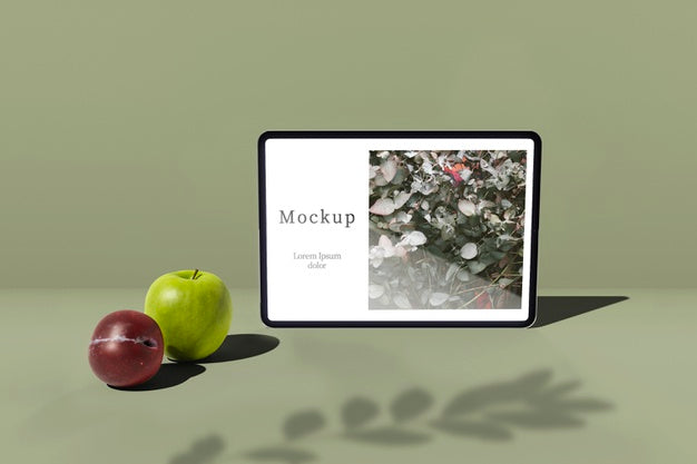 Tablet With Apple And Plum Psd