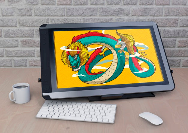Tablet With Artistic Drawing On Table Psd