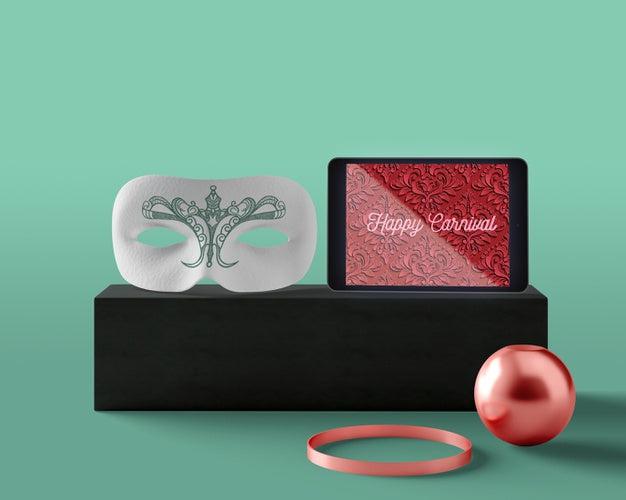 Tablet With Carnival Design Beside Mask Psd