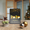 Tablet With New Year Wish On Table Psd