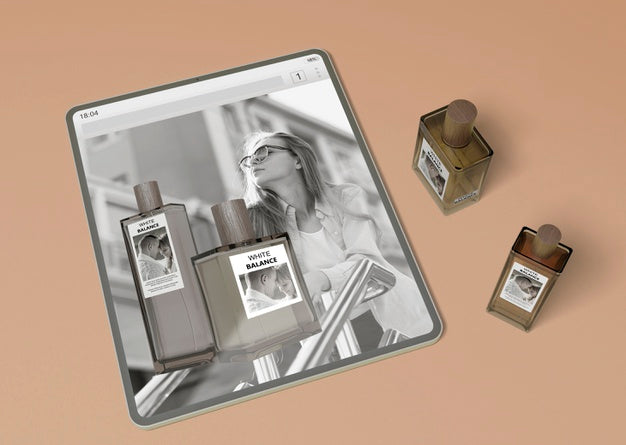 Tablet With Perfume Website And Perfume Bottles Psd