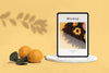 Tablet With Photo And Oranges Psd