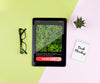 Tablet With Plant And Notebook On Desk Psd
