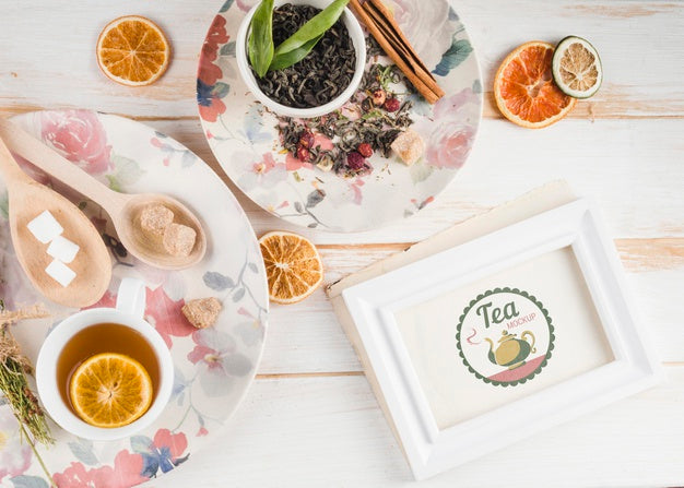 Tea Mock-Up With Citrus And Herbs Psd