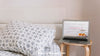 Technology Mockup With Laptop Next To Bed Psd