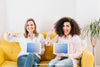 Technology Mockup With Women On Yellow Couch Psd