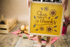 Thanksgiving Mockup With Girl Holding Frame Psd