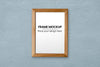 Thin Wooden Frame Over Blue Wall Mockup Psd