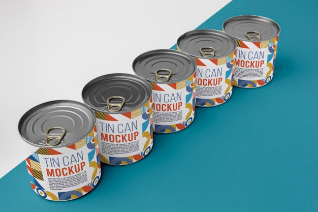 Tin Cans Arranged On Table Psd