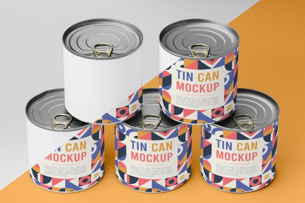 Tin Cans Arranged On Table Psd