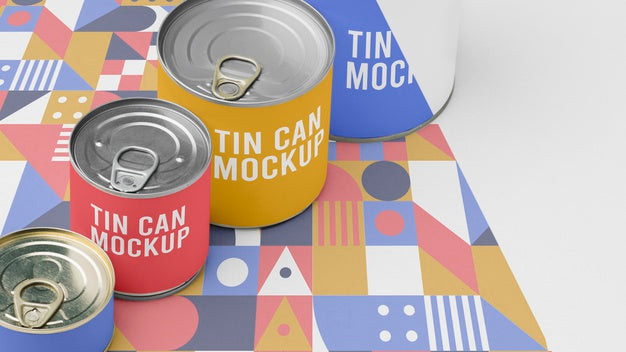Tin Cans Arranged On Table Psd