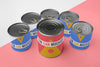 Tin Cans Arranged On Table Psd