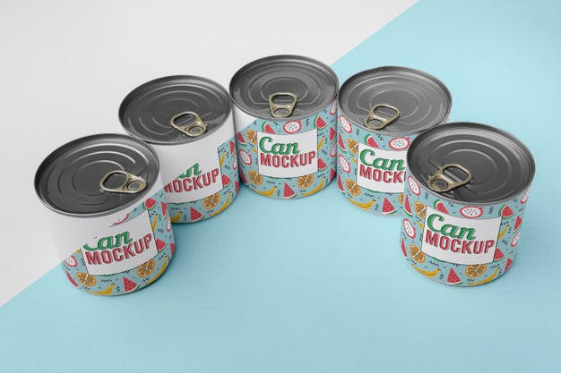 Tin Cans Arranged On Table Psd