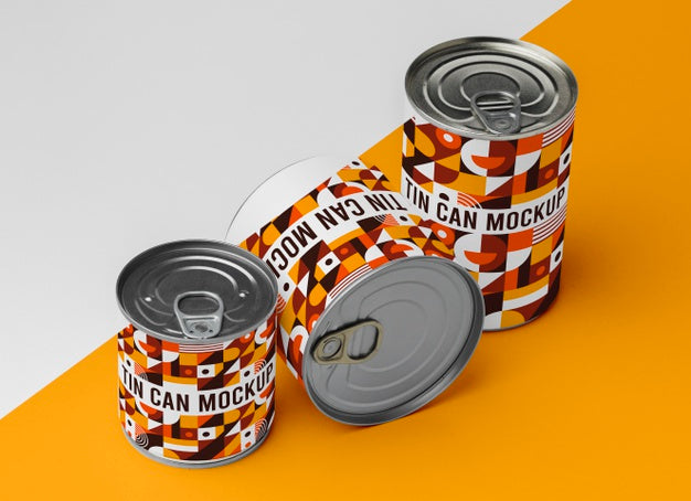 Tin Cans Arranged On Table Psd