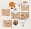 Top View Arrangement Of Brown Paper Envelopes And Wedding Rings Psd