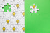 Top View Arrangement With Puzzle On Green Background Psd