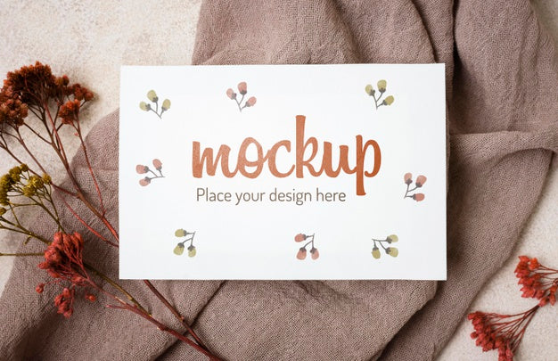 Top View Autumn Mock-Up With Flowers  On Grey Cloth Psd