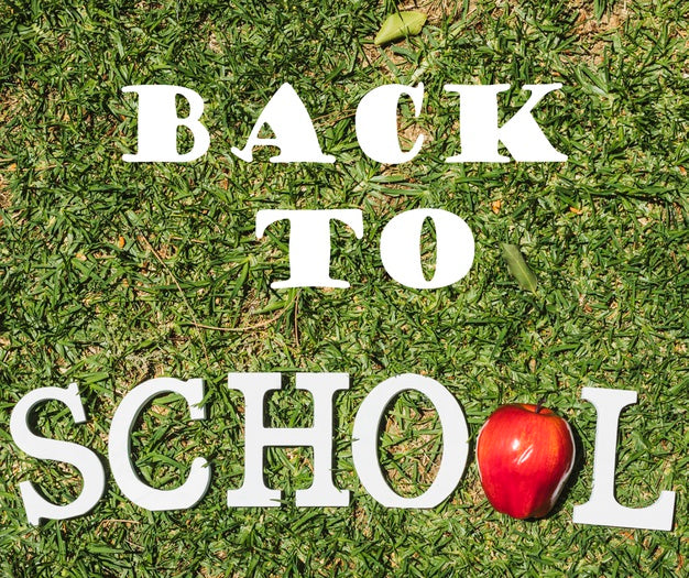 Top View Back To School Message On Grass Psd