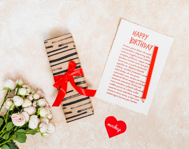 Top View Birthday Greeting With Present And Flowers Psd