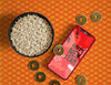 Top View Bowl Of Rice Golden Coins And Phone Mock-Up Psd